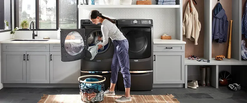 maytag-laundry-room-woman-doing-laundry